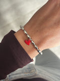 Bracciale semi e cuore rosso