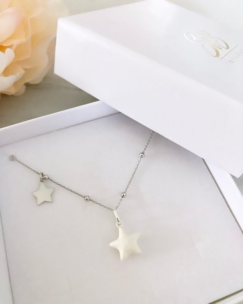 Collana stella bombata e stellina laterale